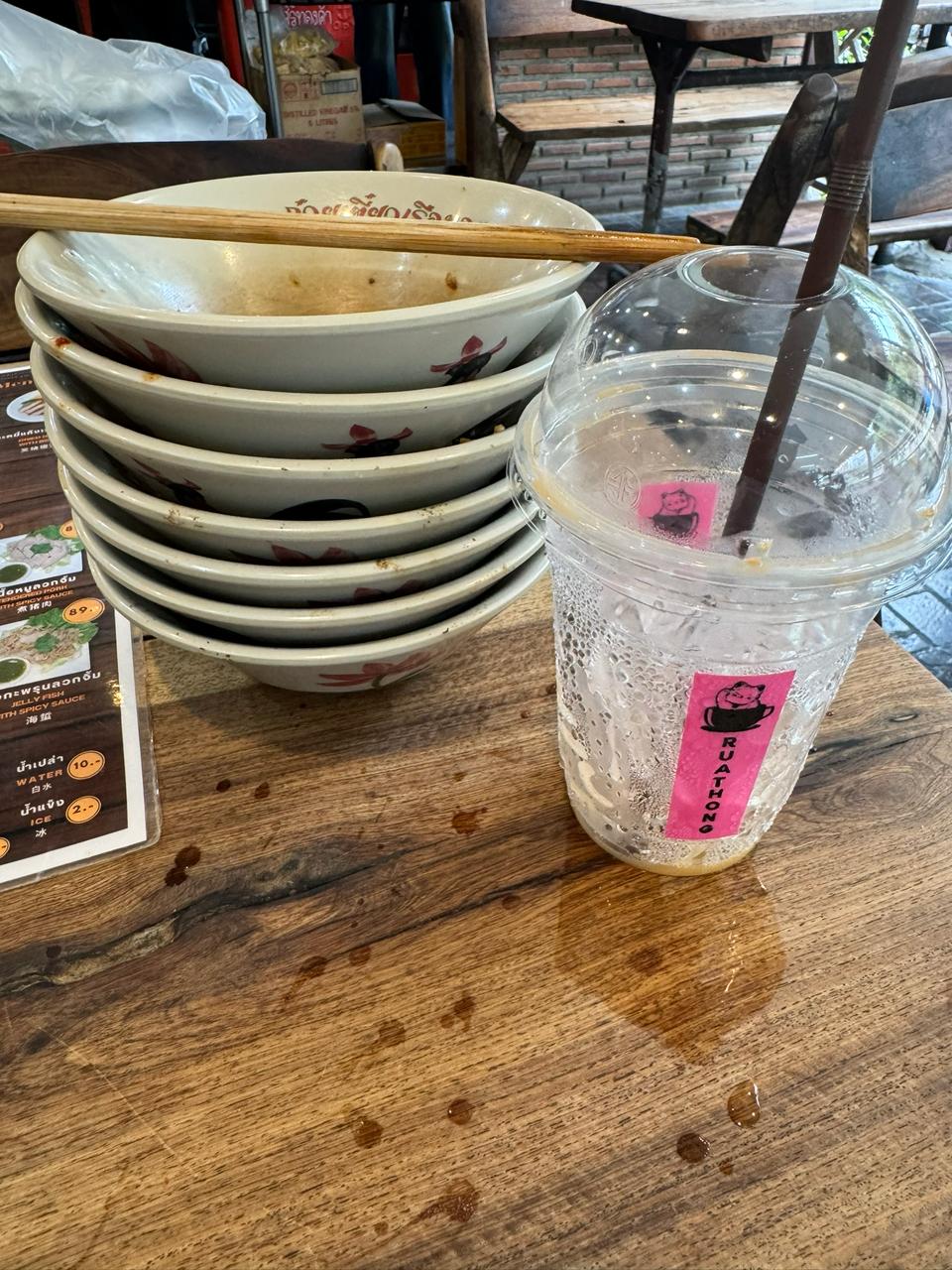 Empty bowl stack and a drink — the 7 bowls.