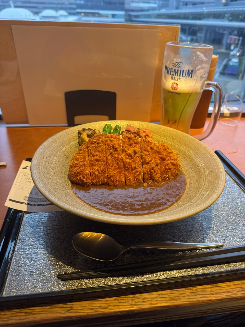 Katsu curry and a Premium Malts beer during the Narita layover.