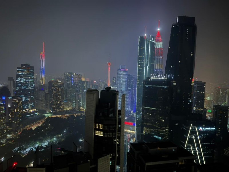 Petronas Towers and the KL skyline at night from the Element suite.