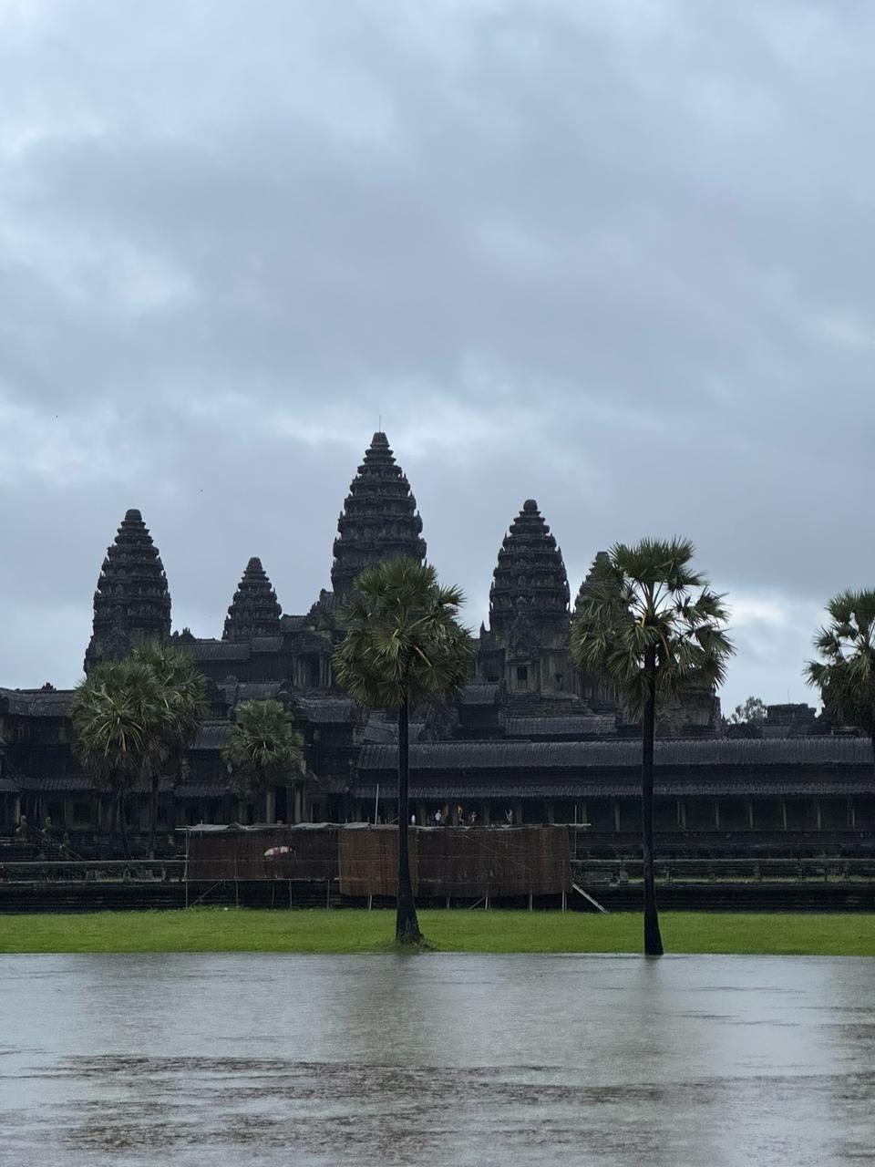 Angkor Wat across the pool, grey morning.