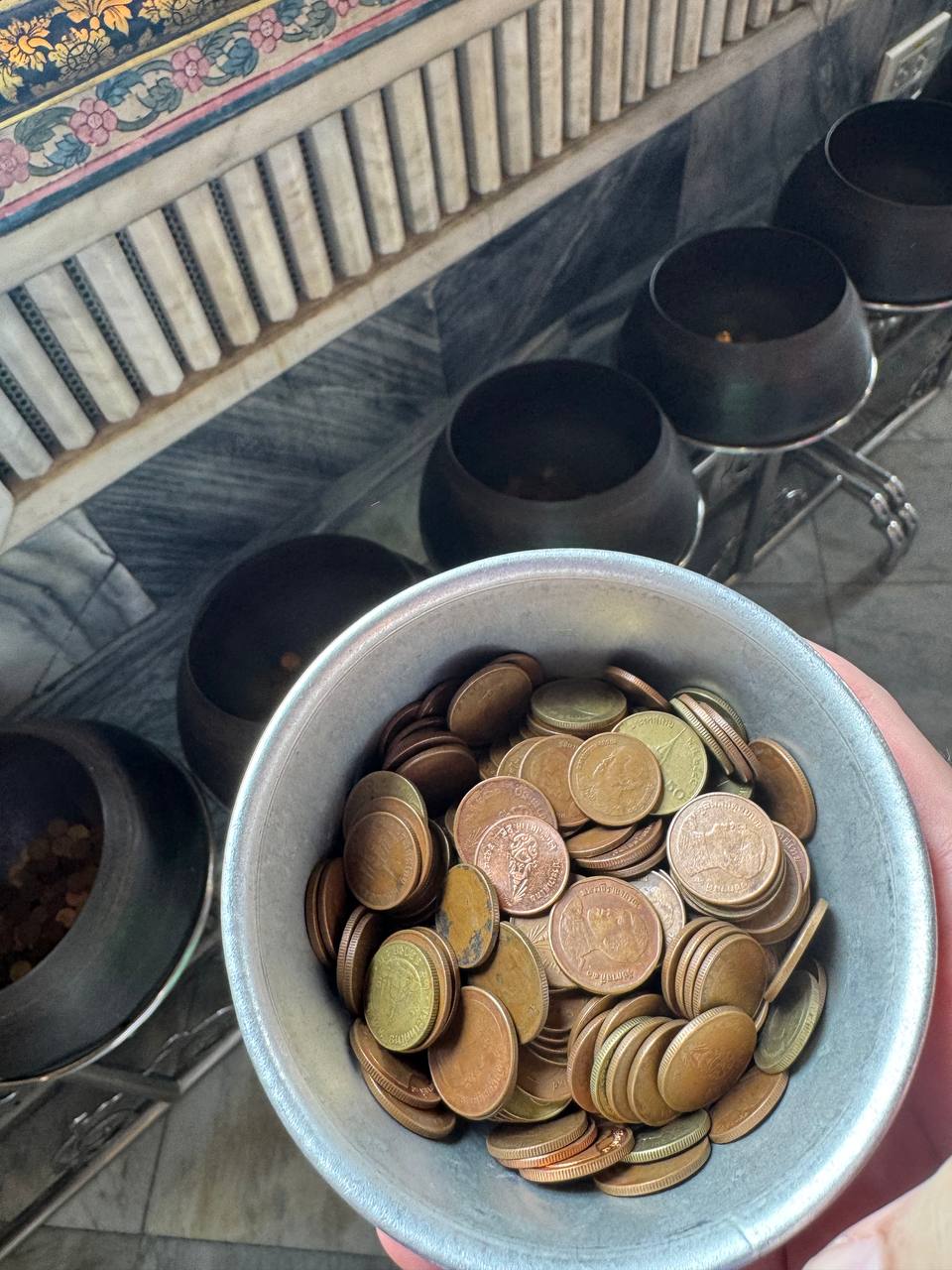 Coins for the 108-bowl ritual at Wat Pho.
